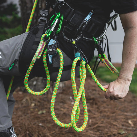 Sidekick Lanyard Manager with carabiners on harness, auto-adjusts to most lanyard diameters for canopy use, lightweight durable.