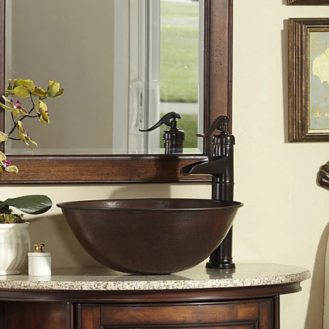 Handmade Aged Copper Vessel Sink 16 Inch Solid Copper Bathroom Sink With Top Notch Craftsmanship on a marble countertop