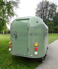 Ready To Rock 10ft Mobile Food Trailer Built On Galvanized Steel Frame With Sleek Mirror Exterior perfect for street vending, showing rear view.