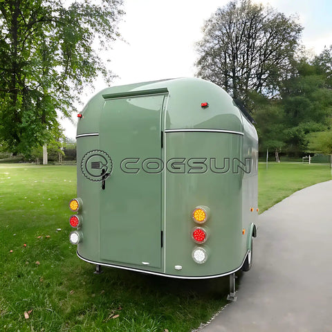 Ready To Rock 10ft Mobile Food Trailer Built On Galvanized Steel Frame With Sleek Mirror Exterior perfect for street vending, showing rear view.