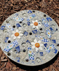 Decorative concrete stepping stone made with a Six Piece Round Stepping Stone Mold Set With Thick Plastic Concrete Molds In 10.63 Inch 11.81 Inch And 12.99 Inch Sizes For DIY Garden Pathway Outdoor Walkway Paving Durable Cement Casting Molds For Easy Release.