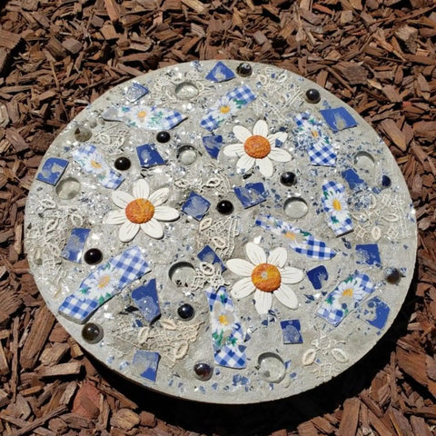 Decorative concrete stepping stone made with a Six Piece Round Stepping Stone Mold Set With Thick Plastic Concrete Molds In 10.63 Inch 11.81 Inch And 12.99 Inch Sizes For DIY Garden Pathway Outdoor Walkway Paving Durable Cement Casting Molds For Easy Release.