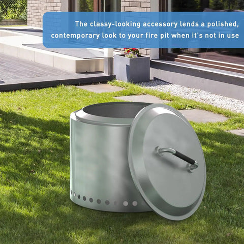 Stainless Steel Fire Pit Lid With Silicone Wrapped Handles for 27 Inch Outdoor Pits placed on green grass near a patio.