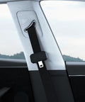 Close-up of Five Pack Silicone Seat Belt Buckle Covers installed in car, black silicone protects interior, universal fit