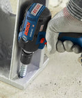 18V EC Brushless Half Inch Impact Wrench fastening a concrete anchor using friction ring and thru-hole design in heavy-duty job