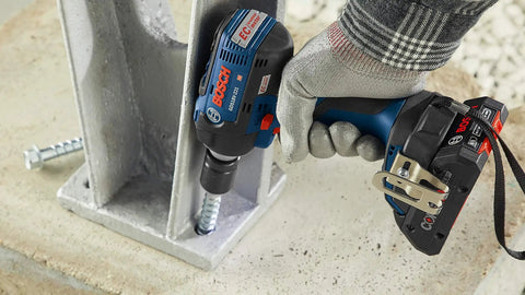 18V EC Brushless Half Inch Impact Wrench fastening a concrete anchor using friction ring and thru-hole design in heavy-duty job