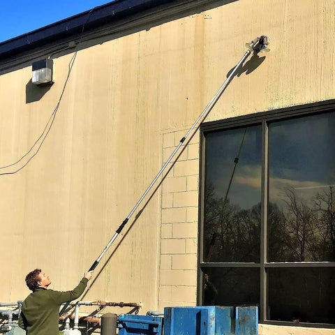 Man using Light Bulb Changer For High Ceilings With Telescoping Pole Heavy Duty Basket Grip For Recessed Lights And Outdoor Flood Lamps