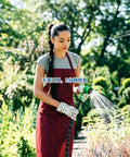 Fresh 2026 Expandable Garden Hose Repair Kit Featuring Four Durable Dual Channel Female Male Connectors To Fix Leaks Instantly For 25 50 75 And 100 Ft Retractable Water Hoses Saving You Major Cash On New Equipment, woman watering garden