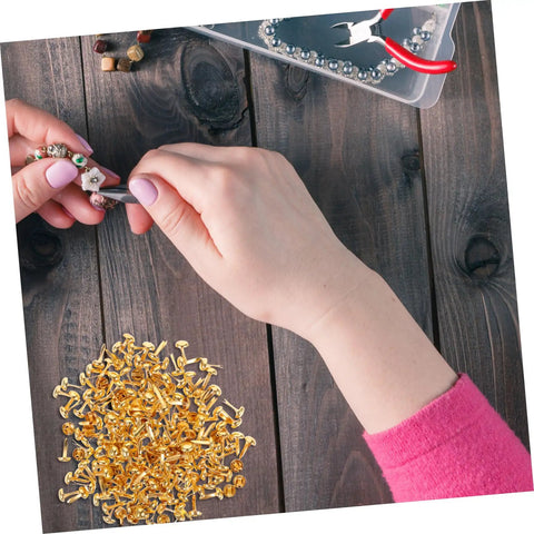Crafting station with 200 Pieces Metal Paper Fasteners Brads Set For Paper Crafts And Scrapbooking Decorative Clips on wooden table