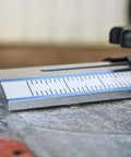 Close-up of Pro Grade Thin Rip Table Saw Jig Guide for Router and Band Saw, showing precision markings and durable design.