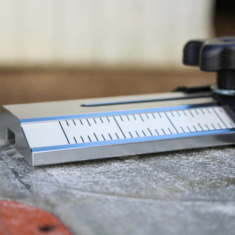 Close-up of Pro Grade Thin Rip Table Saw Jig Guide for Router and Band Saw, showing precision markings and durable design.