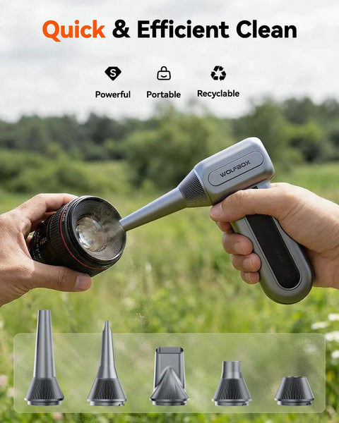 Silver Gray Electric Air Duster With 110000 RPM High-Speed Turbo Blast cleaning a camera lens, handheld cordless with nozzle.
