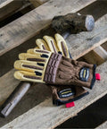 Goatskin Leather Work Gloves For Men With ANSI Cut Resistance A1 Heavy Duty Construction And Warehouse Gloves A Real Workhorse For Construction Gardening And More Durable Top Grain Leather 2X Large lying on a pallet with a hammer.