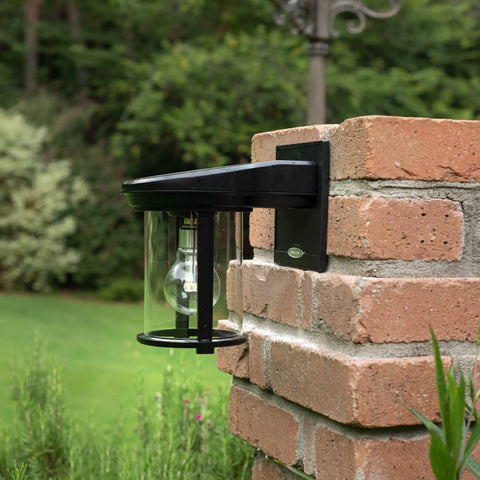Coach Lantern Solar Outdoor Wall Light Fixture Sconce Black With Dusk To Dawn Lighting mounted on brick wall.