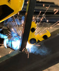 Hella Strong Mini Adjustable Welding Magnet With Slick On Off Rotating Base And 150 Lb Hold Power For Multi Angle Metal Fabrication in use, welding sparks flying.