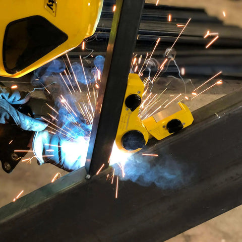 Hella Strong Mini Adjustable Welding Magnet With Slick On Off Rotating Base And 150 Lb Hold Power For Multi Angle Metal Fabrication in use, welding sparks flying.