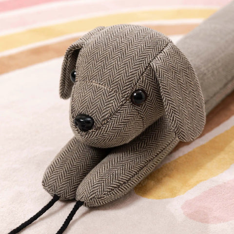 Heavy Duty Door Draft Stopper To Keep The Chill Outta Your Space Weighted Noise Blocker in dog design, herringbone fabric, 38 inches long.