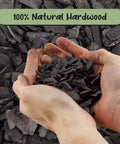 Hands holding hardwood charcoal soil additive for indoor plants 2 quarts, perfect for orchids, terrariums, and gardens.