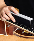 Guitar Fingerboard Luthier Tool Kit in use with fret leveling beam on guitar fingerboard for even fretwork.