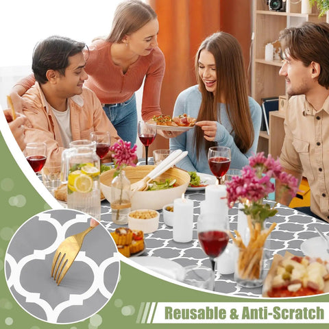 Grey Elastic Flannel Backed Vinyl Table Cover For 6 Foot Tables Waterproof Wipeable Indoor Outdoor Rectangle Picnic Tablecloth Windproof Fit For No Fuss Everyday Use 30x72 Inches with people dining.