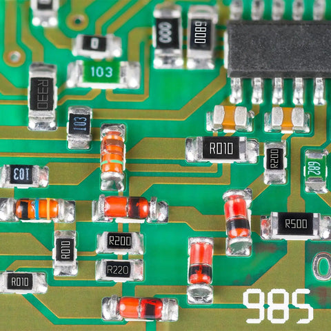 Close-up of a 2512 Surface Mount Chip Resistor Kit Twenty Piece 100 Ohm One Percent Tolerance One Watt Ceramic Resistors on a PCB
