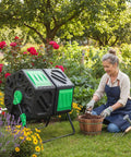 Hexagon Dual Chamber Compost Tumbler Workhorse With 34.5 Gallons, Two Rotating Chambers And Sliding Doors in garden setting