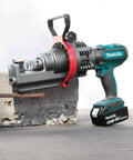Makita Xcs01t1 18V Lxt Lithium Ion Cordless Rebar Cutter Kit with rotating head cutting rebar in concrete block.
