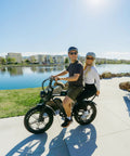 Two adults riding Beast 1000W Electric Bike For Adults With 20 Inch Wheels Removable 15.6Ah Battery Up To 60 Mile Range