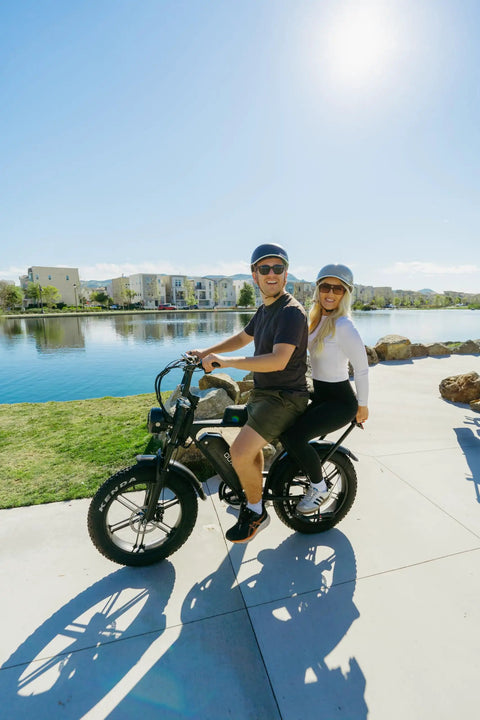 Two adults riding Beast 1000W Electric Bike For Adults With 20 Inch Wheels Removable 15.6Ah Battery Up To 60 Mile Range