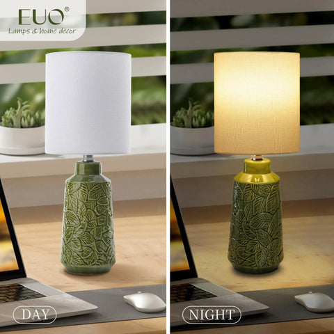 Green Ceramic Table Lamp With Leaf Pattern And White Linen Shade, 17 Inch Tall, shown during day and night, on wooden desk