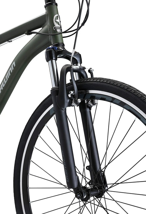 Close-up of All-Terrain Go-To Hybrid Bike With 700c Wheels 21-Speed Gearing Aluminum Frame Suspension Fork, front view.