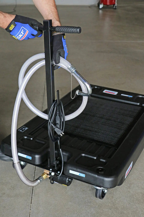 17 Gallon Low Profile Truck Drain With 120V Electric Pump showing handle and discharge hose for easy fluid cleanup.