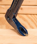 Close-up of Pro Claw Pry Bar 16 Inch High Leverage Heavy Duty 3 In 1 Roof Siding Construction Tool With Nail Puller in action on wood