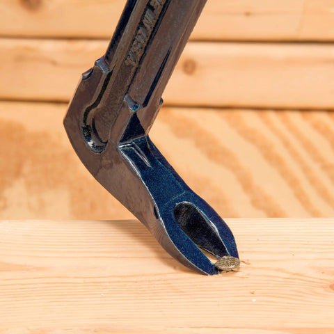 Close-up of Pro Claw Pry Bar 16 Inch High Leverage Heavy Duty 3 In 1 Roof Siding Construction Tool With Nail Puller in action on wood