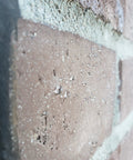 Close-up of brick with Ultimate Sealant Invisible Water Repellent Coating for Concrete and Masonry Porous Surfaces SiO2 Nano Based