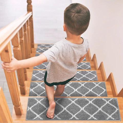 Child walking down steps with 15 Piece Non Slip Stair Treads For Wooden Steps Indoor Carpet Runner Rugs Mat 8x30 Inches Gray Diamond Pattern Soft Grip Easy Install Durable Polyester