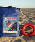 Patriot Wave 7.5 Parafoil Kite package on beach, Easy To Fly Single Line Beginner Kite With No Assembly, 28 W x 36 H x 10 D