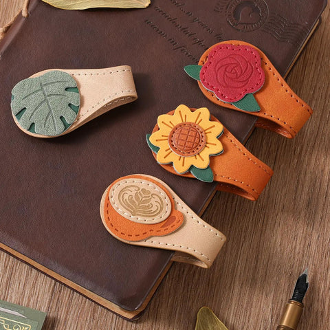 4 Piece Vintage Magnetic Leather Bookmarks With Retro PU Clip, featuring colorful floral designs on a brown leather notebook.