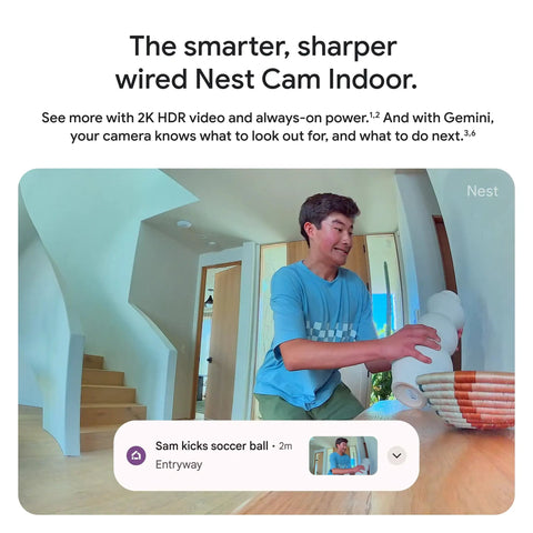 Person setting up Nest Cam Indoor Wired 3rd Gen Security Camera with crisp 2K HDR video and Gemini AI, near staircase, Snow finish.