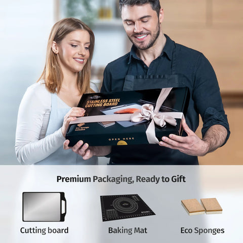Matiks stainless steel cutting board set in black gift box with cream ribbon, front view.