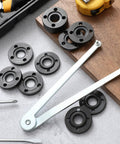 Crush Any Grinding Task With This Badass Angle Grinder Wrench Kit Including 25 Universal Flange Nuts And Tough Adjustable Spanners For Zero Hassle Workshop Wins Daily, showing black flange nuts and wrench.