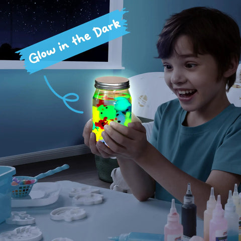 Child excitedly holding Glow In The Dark Water Gel Kit For Kids with Ten Gels Twelve Sea Creature Molds Preserving Bottle and Sparkle Gels.