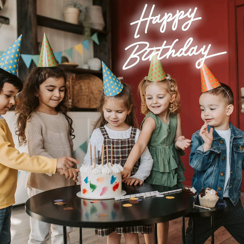 Children celebrating with cake under dimmable LED neon birthday sign 23 inch wall backdrop light for party decor and photo op.