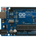 Top Shelf Electronics Learning Kit For Absolute Beginners With Straight Up Step By Step Guides Featuring Compatible Sensor Modules And Robot Tools To Fast Track Your Maker Projects. Arduino Uno board with USB and pin headers.