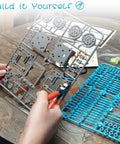 14-In-1 Solar Powered Robot Kit For Kids A Hands On STEM Building Toy With Gears Wheels Shafts And Plates Create 14 Robots From Beginner To Advanced From Wagging Tail Dog To Running Beetle And Walking Crab assembled gray plastic sprues and blue parts