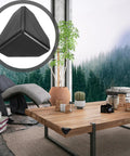 100Pcs Black Plastic Corner Protectors for boxes and desks shown on a wooden table in a living room