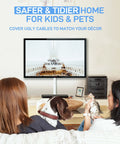 Two people watching TV with pets, large wall cord hider for 3 to 4 cables with snap on design white cable management cover visible.