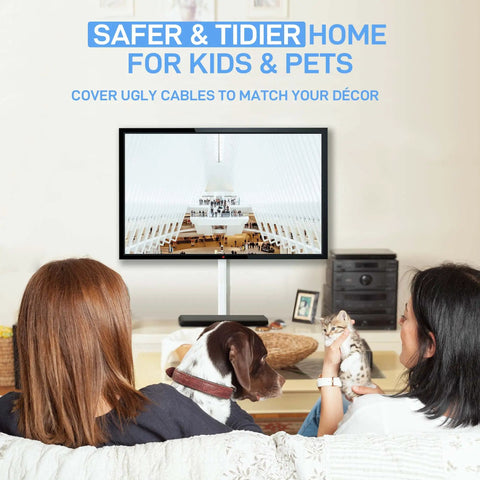 Two people watching TV with pets, large wall cord hider for 3 to 4 cables with snap on design white cable management cover visible.