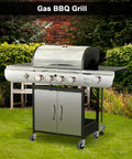 Outdoor gas BBQ grill with stainless steel burners and side shelves on a green lawn, surrounded by a brick wall and shrubbery.
