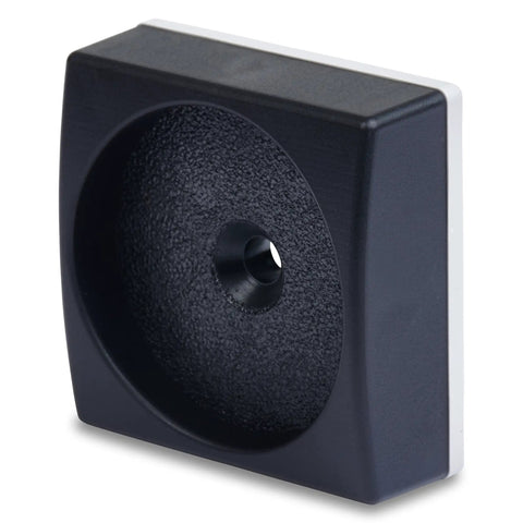Black low profile wall protector for baby gates, showcasing flat top design and soft rubber backing.